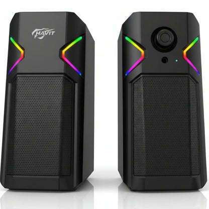 Black computer speakers with RGB lighting on a white background