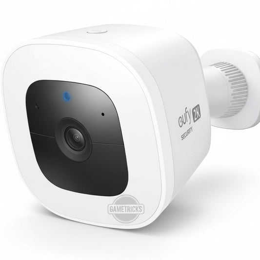 White security camera with a black lens on a white background