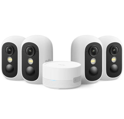 Set of four security cameras and a central hub on a white background
