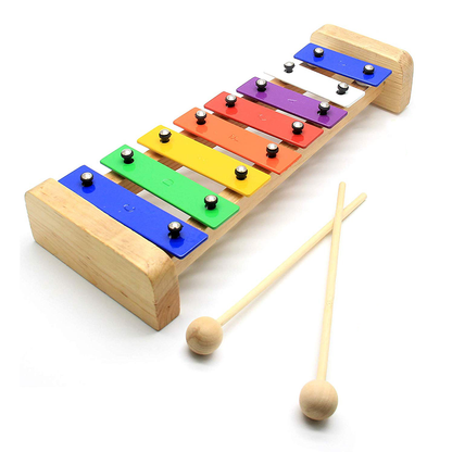 Original photo of colorful rainbow xylophone with eight bars and two wooden mallets.
