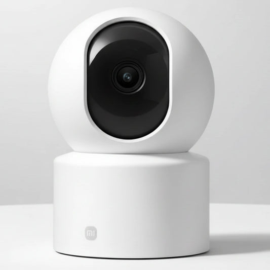White security camera with black lens on a white background